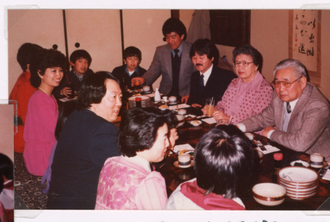 Isoshima family dinner celebration (ddr-densho-477-572)