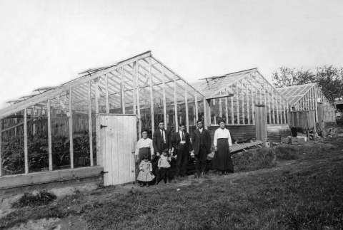 Family in front of greenhouse (ddr-densho-134-14)