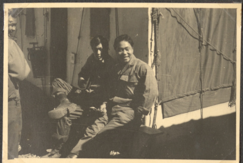 Four men sitting outside tent (ddr-densho-466-43)