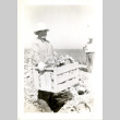 Man with crate of produce (ddr-csujad-26-95)