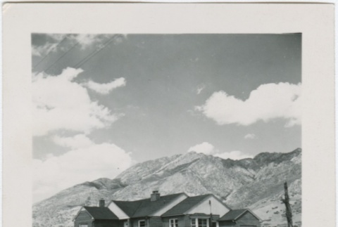 View of a house with mountains in the distance (ddr-densho-338-290)
