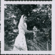 Nisei woman in garden (ddr-densho-363-322)