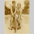 A couple posing with a bicycle (ddr-njpa-1-1326)