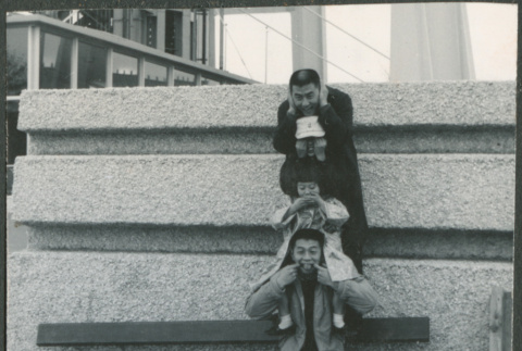 Four people joking around (ddr-densho-523-392)