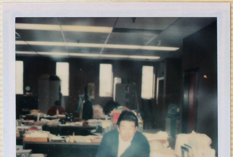 Joe Kakaki in office (ddr-densho-426-1232)