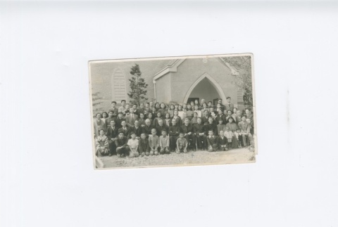 (Photograph) - Image of  priests, nuns, men, women and children outside church (Front) (ddr-densho-330-277-master-2da349998f)