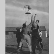 Boys playing basketball at Granada incarceration camp (ddr-csujad-14-45)
