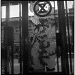 Sign on door of business (ddr-densho-426-297)