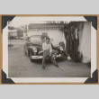 Man leaning on a bumper (ddr-densho-542-155)