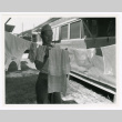 Private William Okawaki hanging laundry (ddr-densho-1007-99)