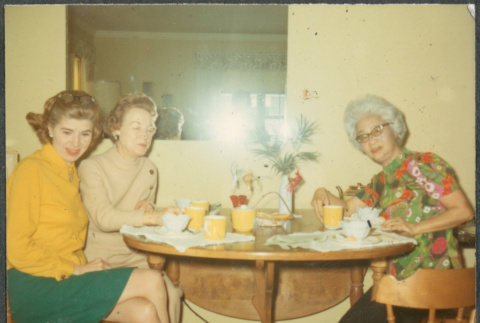 Three women sitting at table (ddr-densho-523-624)
