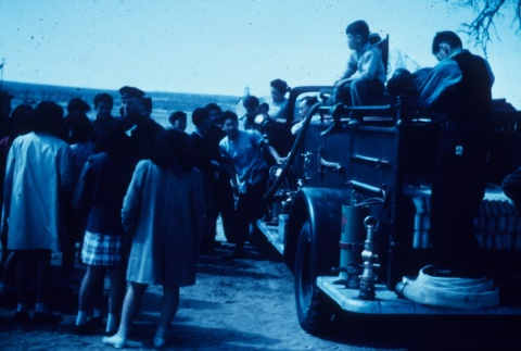 Japanese Americans on a fire truck (ddr-densho-160-70)