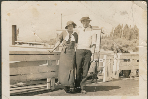 Couple standing on pier (ddr-densho-316-98)