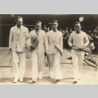 Japanese tennis players walking with another pair (ddr-njpa-4-1537)