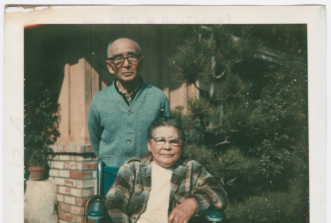 Man standing and woman in wheelchair (ddr-densho-501-20)