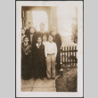 Group of men and boys posing for photo on porch (ddr-densho-483-564)