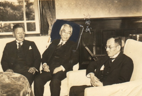 Three men seated in a room (ddr-njpa-4-171)