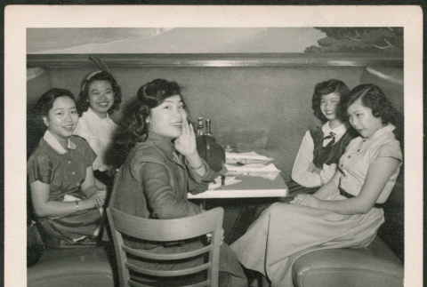 Group of women sitting in diner booth (ddr-densho-293-153)