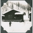 Man standing outside building in snow (ddr-ajah-2-303)