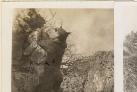 Man climbing rocks (ddr-densho-466-298)