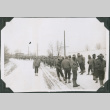 Men walking on road in snow (ddr-ajah-2-447)
