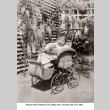 Hatsuyo Ozeki in baby carriage with doll (ddr-ajah-6-792)