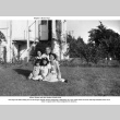 Group posed for photo in backyard (ddr-ajah-6-195)