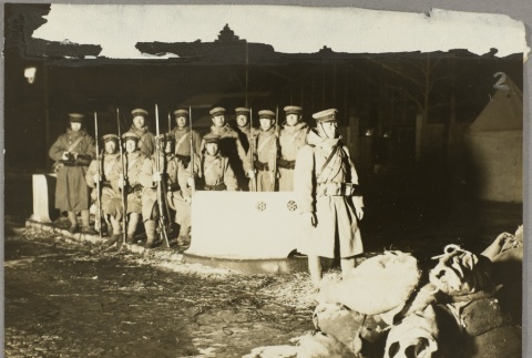 Japanese soldiers standing guard on a street corner (ddr-njpa-13-1399)