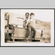Photo of two children in a pickup truck bed (ddr-densho-483-348)