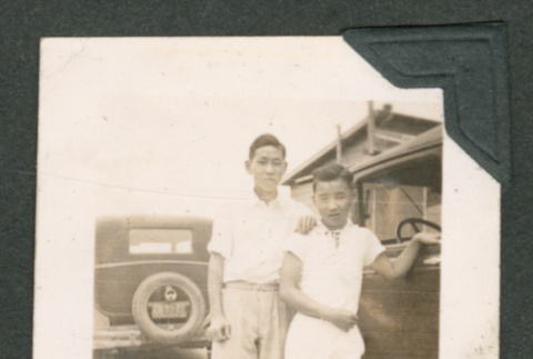 Two boys next to car (ddr-densho-550-295)