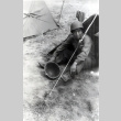 Hisashi Jack Mukumoto sitting outside tent (ddr-densho-474-238)