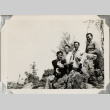 Four men sitting on rocks (ddr-densho-587-35)