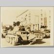 Soviet soldiers riding tanks on a city street (ddr-njpa-13-443)