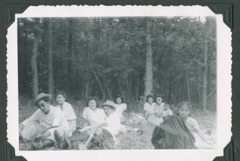 Group lounging in a forest (ddr-densho-471-40)