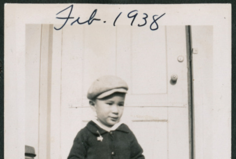 Photo of a child next to a pram (ddr-densho-483-711)