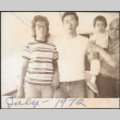 Chester Sakura holding baby with younger couple (ddr-densho-523-581)