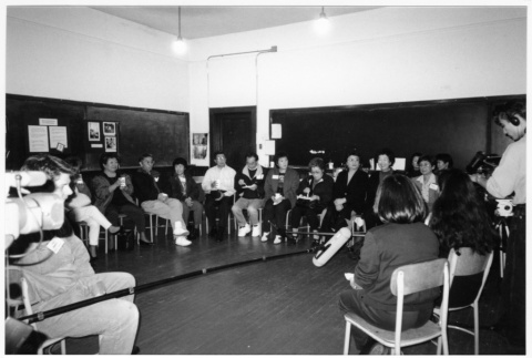 Alums and attendees sitting in chair circle at Japanese Language School Reunion (ddr-densho-506-100)