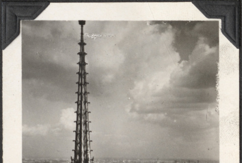 View over city with spire in foreground (ddr-densho-466-699)