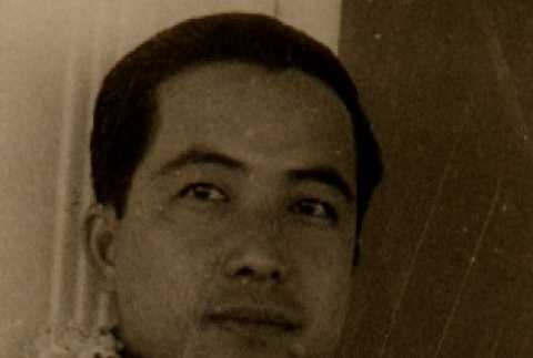 Den Obinata wearing leis (ddr-njpa-4-1670)