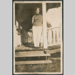Woman standing  on porch (ddr-densho-523-11)
