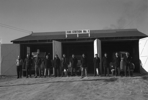 Firemen standing in front of Fire Station No. 1 (ddr-fom-1-765)