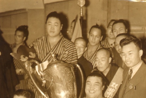 Haguroyama holding trophy and posing with others (ddr-njpa-4-11)
