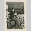 Mr. Nakata stands with his chrysanthemums (ddr-densho-37-1192)