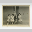 Nisei women and man in front of barrack (ddr-csujad-44-18)