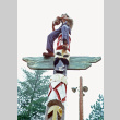 Calvin Iyoya playing football from the top of a totem pole (ddr-densho-336-925)