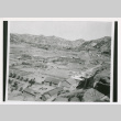 Aerial view of buildings and hills (ddr-densho-1007-186)