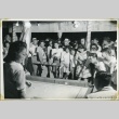 A crowd watching a game at a camp celebration (ddr-manz-4-209)