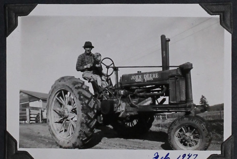 Man and boy on tractor (ddr-densho-359-1510)