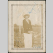 Woman in hat and white pants in field (ddr-densho-316-393)