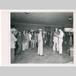 Sgt. Markiewicz, Pfc. Supulsky, and group of incarcerated Japanese Americans (ddr-densho-1007-22)